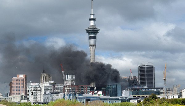 Auckland city fire with Sky Tower in background